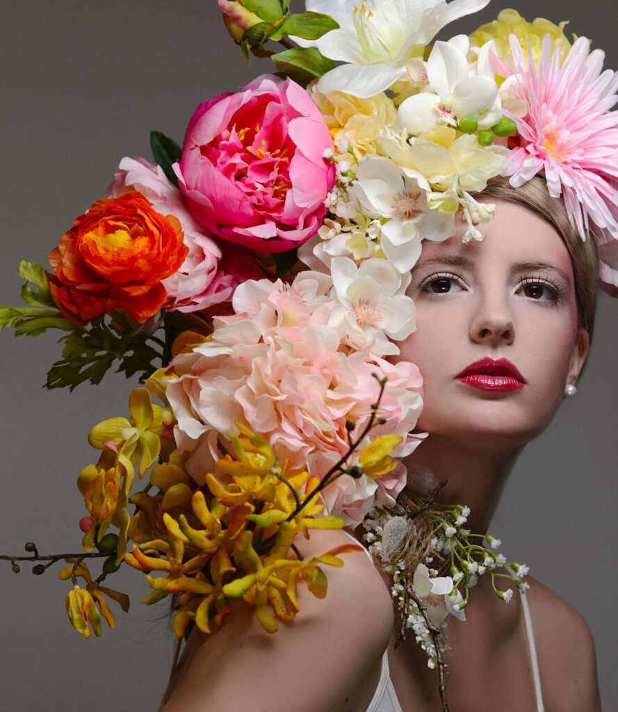 A woman's photograph with a bunch of flowers on her head